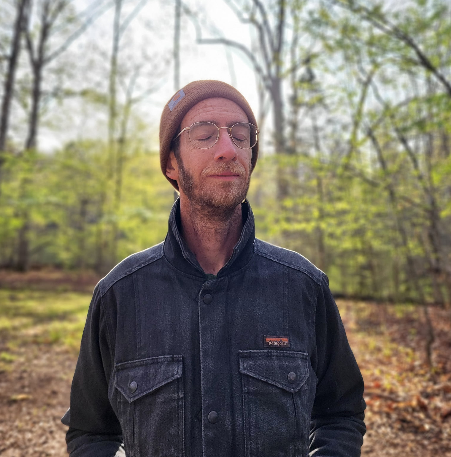 Kyle Numann in the woods, photo by Emily Kendall